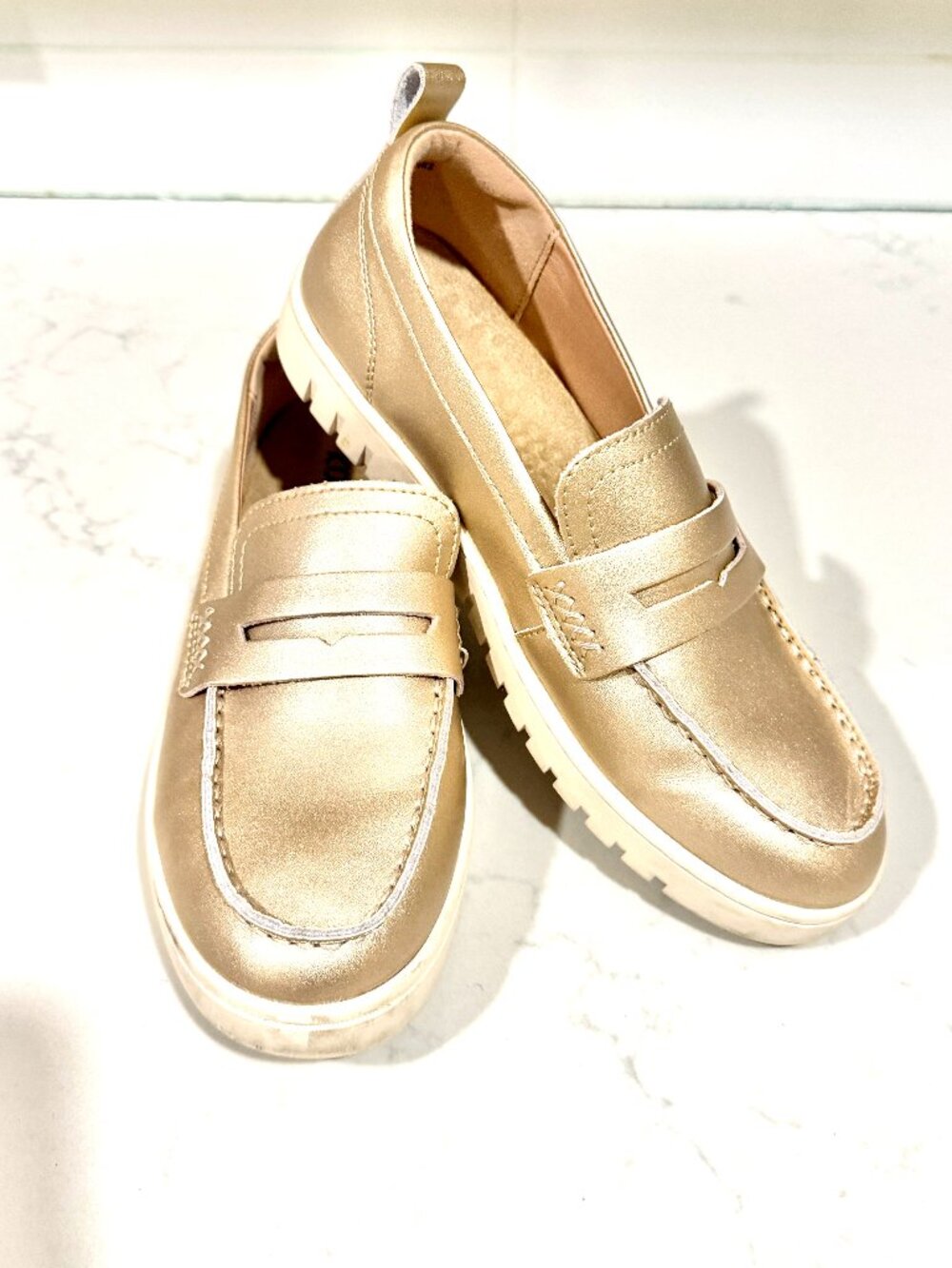 gold penny loafer